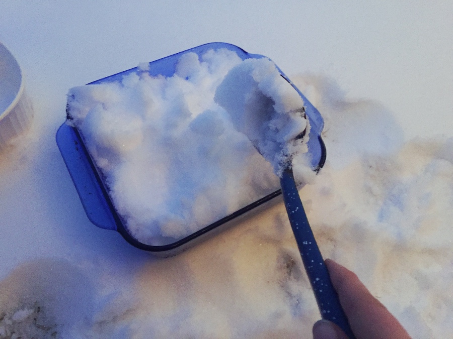 preparing fresh snow for sugar on snow
