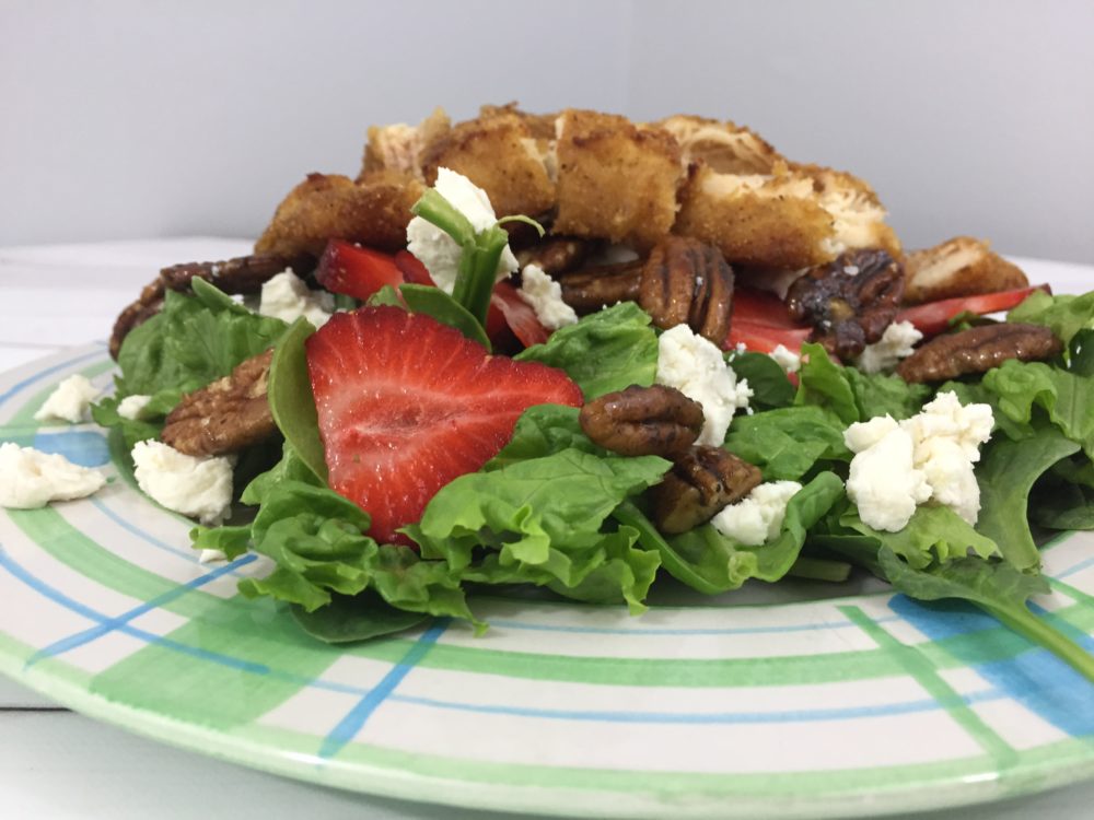 Chicken strip salad with fresh strawberries and candied pecans