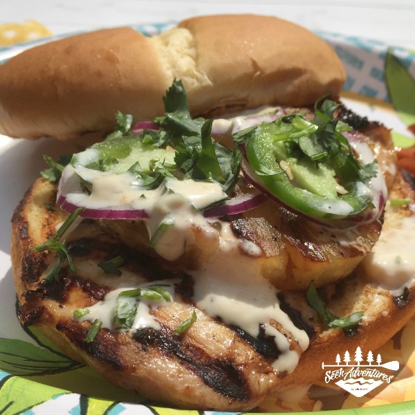 These Hawaiian Chicken Sandwiches are a quick and easy meal for a summer cookout or backyard bbq. Make your chicken sandwich amazing by adding the Teriyaki Ginger Mayo. Spicy, sweet and delicious. #summergrilling #grilledchicken #chickensandwich #teriyaki #teriyakichicken #mayo #teriyakimayo #pineapple #campfire #grill #grilling #familycookout #memorialdayweekend #famikybbq #famikypicnic #backyardcookout #backyardbbq #poolparty #easycampingmeals #easycampingmenu #campingmeals #winnerwinnerchickendinner #adventure #whatsfordinner #seekadventures #mastersummer Chicken Sandwich, Flavored Mayo, Flavored mayonnaise, teriyaki mayo, teriyaki mayonnaise, teriyaki ginger mayonnaise juliedkohl.com