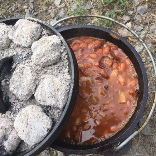 https://seekadventuresblog.com/wp-content/uploads/2018/05/dutch-oven-baked-beans-cooking-with-charcoal-500x500.jpg