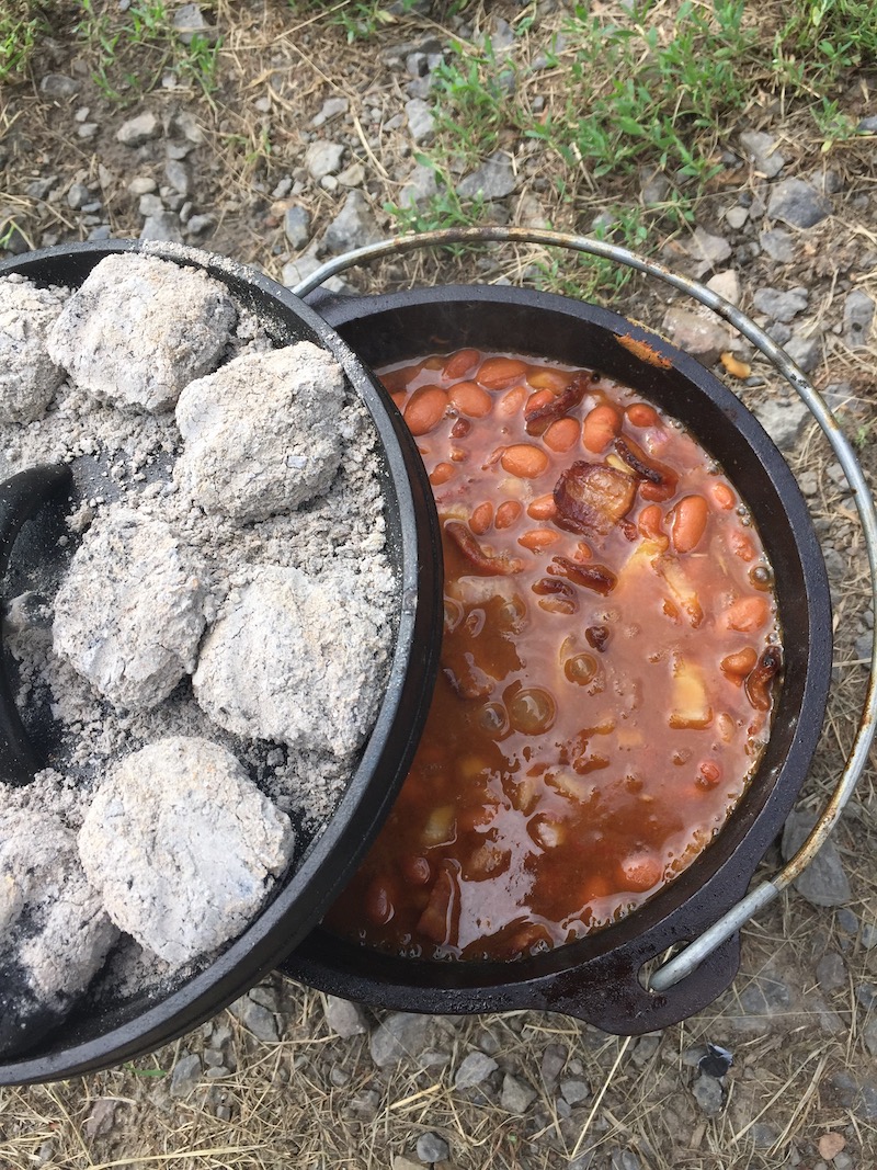 Dutch oven with charcoal and baked beans